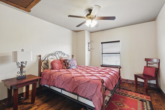 5101 Hells Gate Loop, Possum Kingdom Lake, TX 76475 - bedroom with dark wood finished floors, baseboards, and a ceiling fan