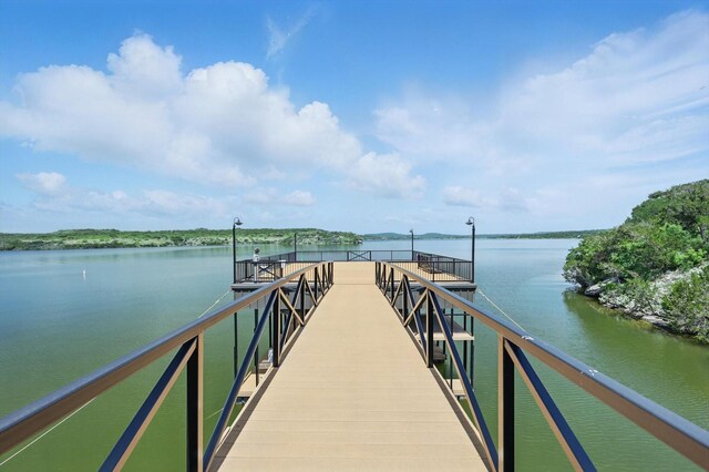 5101 Hells Gate Loop, Possum Kingdom Lake, TX 76475 - aerial view of property and surrounding area with a nearby body of water