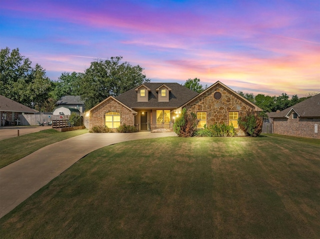 view of front of home with a lawn