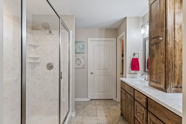 bathroom featuring vanity and an enclosed shower