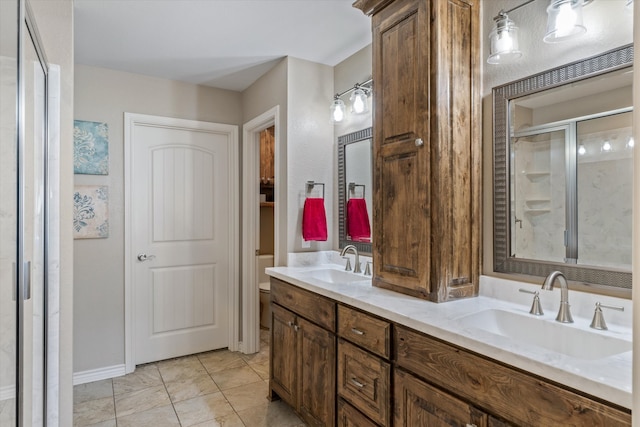 bathroom featuring vanity, toilet, and an enclosed shower