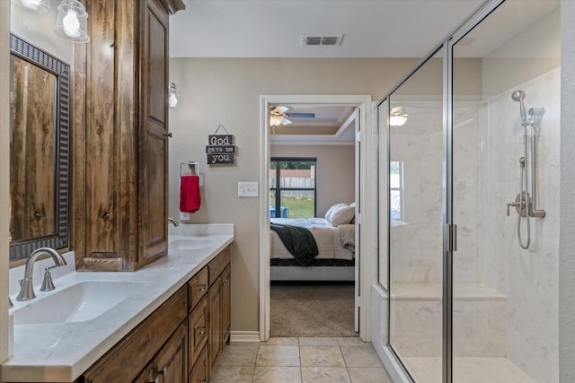 bathroom featuring tile patterned flooring, vanity, and walk in shower