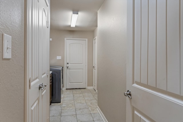 washroom with washer / clothes dryer