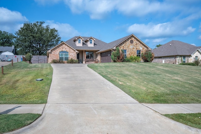 view of front of property featuring a garage and a front lawn