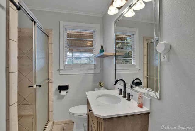 bathroom with crown molding, a shower with door, and toilet