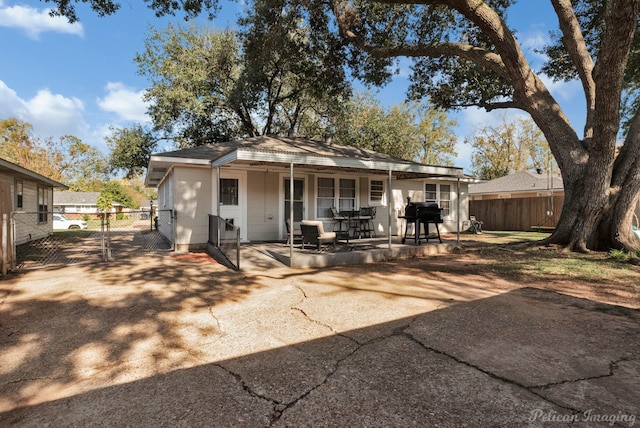 back of property with a patio area