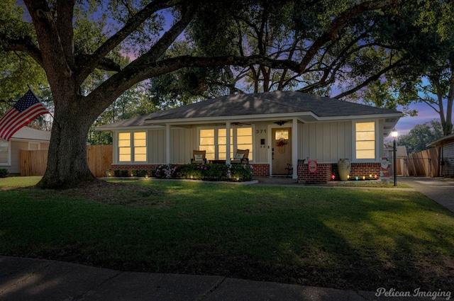 single story home featuring a yard