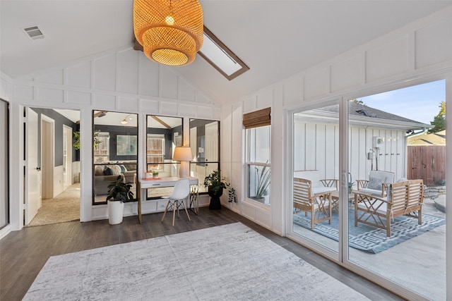 sunroom featuring lofted ceiling