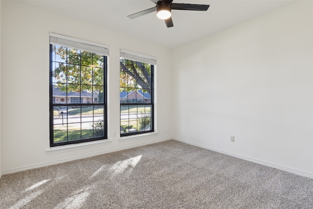 carpeted empty room with ceiling fan