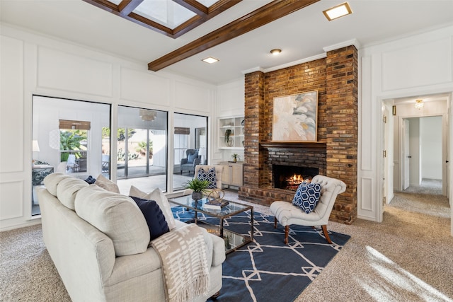 living room featuring beam ceiling, crown molding, carpet, and a brick fireplace