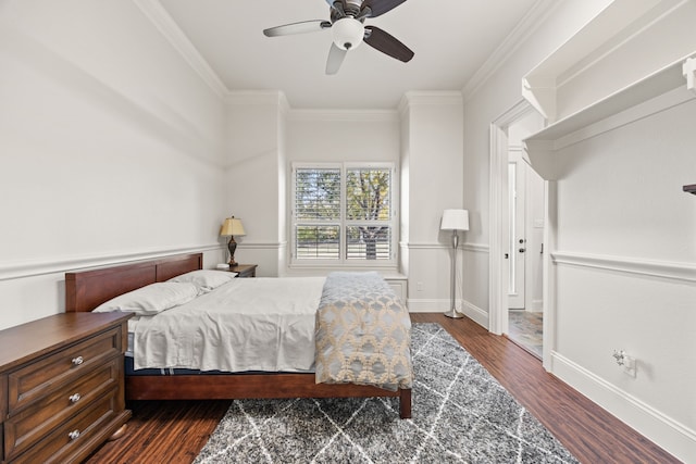 bedroom featuring ceiling fan, crown molding, and dark hardwood / wood-style floors