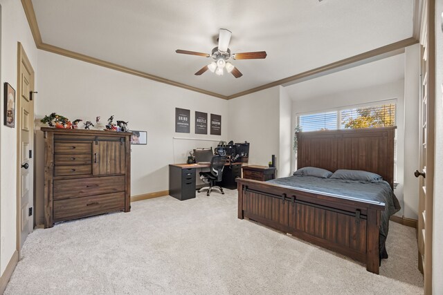 carpeted bedroom featuring ceiling fan and ornamental molding