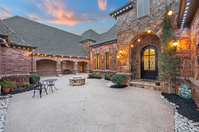 view of patio terrace at dusk