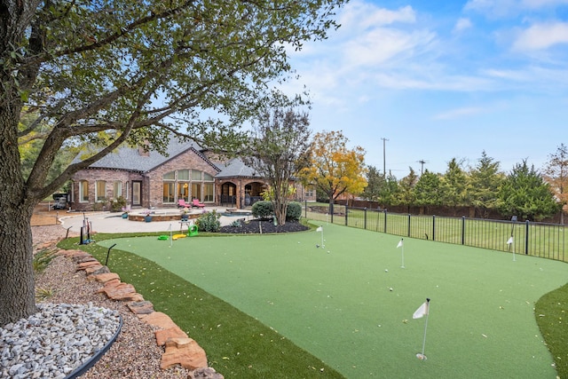 view of property's community with a patio area