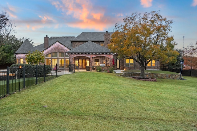 exterior space featuring a lawn and a patio area