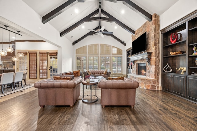 living room with dark hardwood / wood-style flooring, ceiling fan, beam ceiling, high vaulted ceiling, and a fireplace