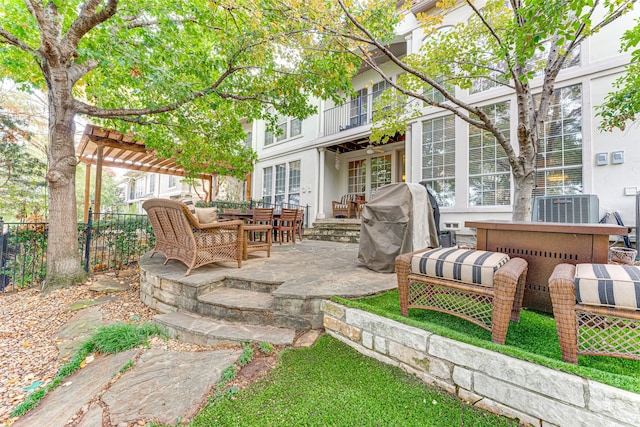 view of patio / terrace featuring a pergola, area for grilling, and central AC unit