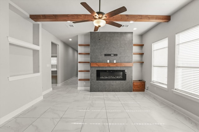 unfurnished living room with a tiled fireplace, vaulted ceiling with beams, and ceiling fan