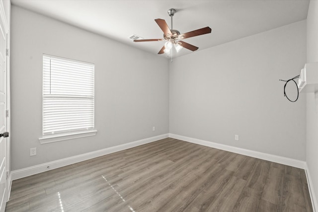 empty room with wood-type flooring and ceiling fan