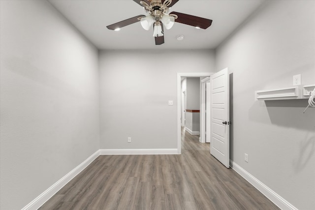 empty room featuring hardwood / wood-style flooring and ceiling fan