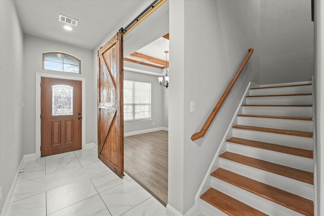 entrance foyer featuring a barn door