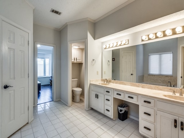 bathroom featuring tile patterned flooring, a textured ceiling, toilet, and crown molding