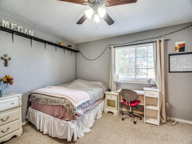 bedroom with light colored carpet and ceiling fan