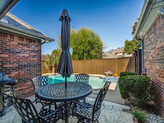 view of patio / terrace featuring a fenced in pool