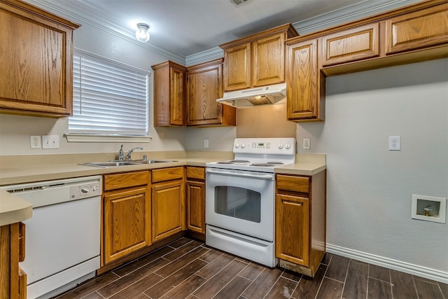 kitchen with white appliances, crown molding, dark wood-type flooring, and sink