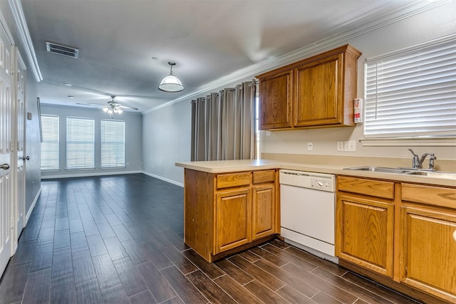 kitchen with sink, crown molding, white dishwasher, decorative light fixtures, and kitchen peninsula