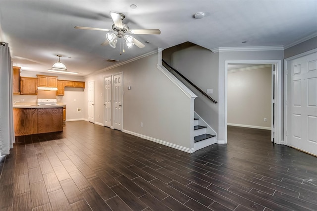 unfurnished living room featuring ceiling fan, crown molding, and dark wood-type flooring