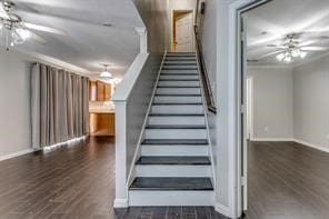 staircase with wood-type flooring, ceiling fan, and ornamental molding