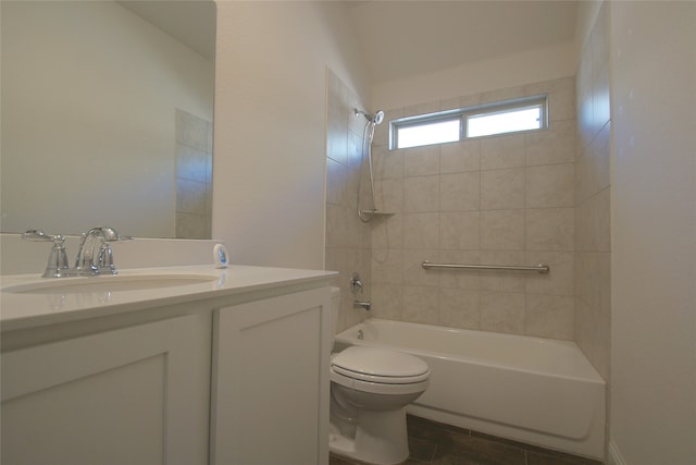 full bathroom featuring tile patterned floors, vanity, toilet, and tiled shower / bath