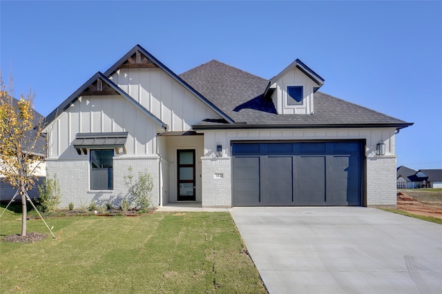 view of front of home with a garage and a front lawn