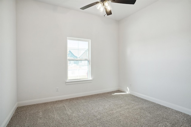 spare room featuring ceiling fan and carpet