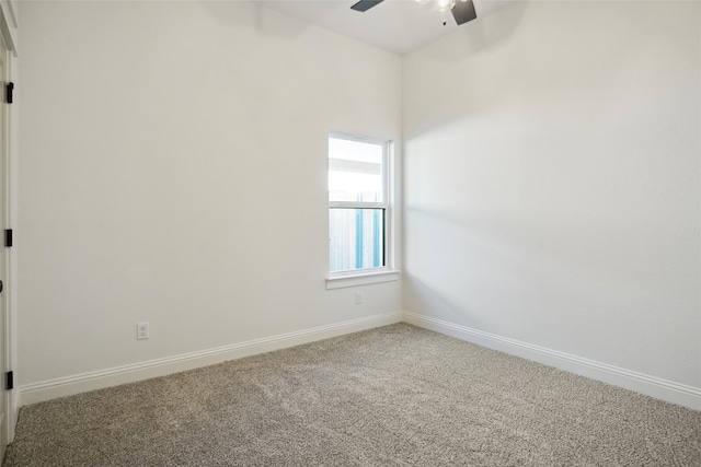 empty room with ceiling fan and carpet flooring