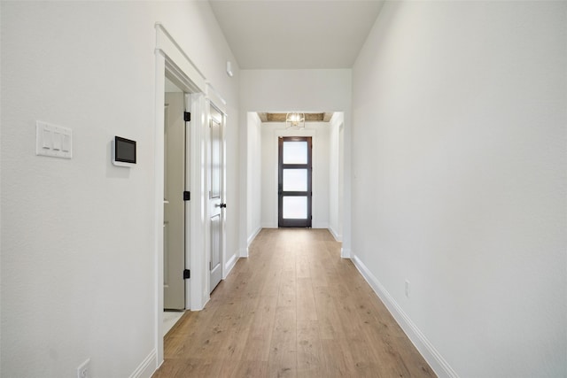 hall with light hardwood / wood-style floors