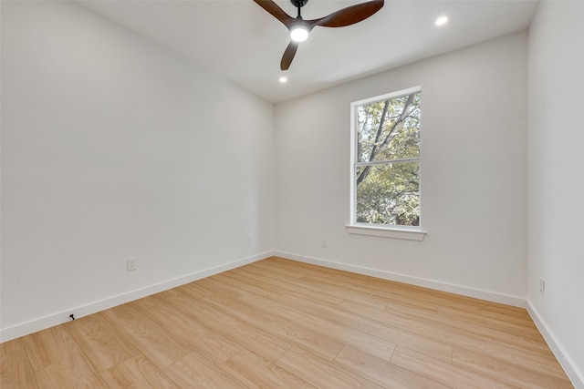 unfurnished room featuring ceiling fan and light hardwood / wood-style floors