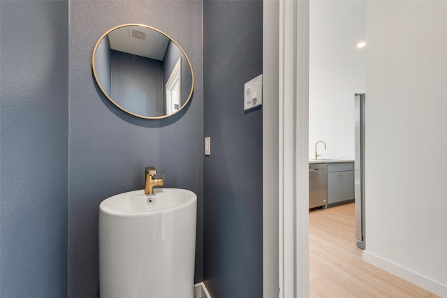 bathroom with hardwood / wood-style flooring