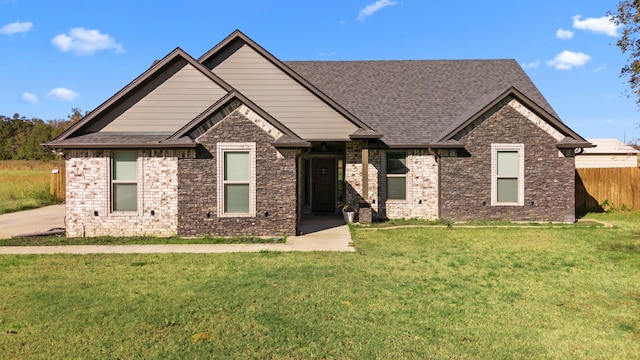 craftsman house with a front lawn