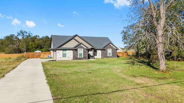 craftsman inspired home with a front lawn