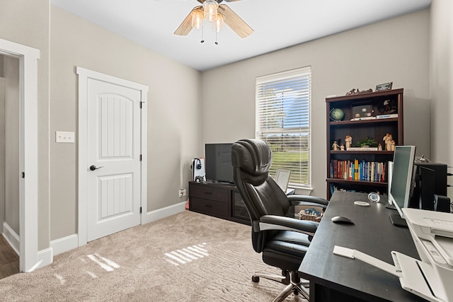 carpeted office with ceiling fan