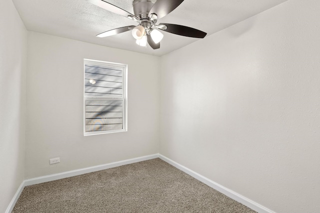 carpeted empty room with a textured ceiling and ceiling fan