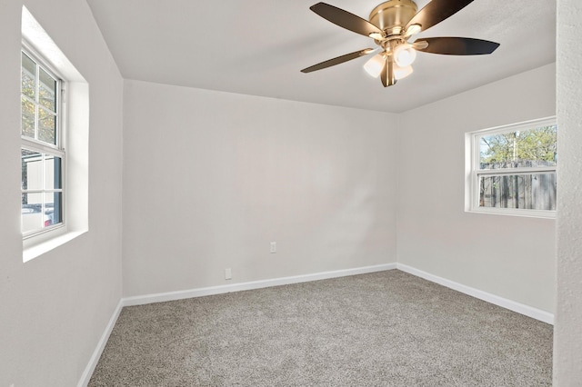 carpeted empty room with ceiling fan