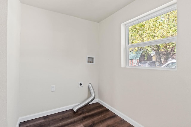 clothes washing area with hookup for a washing machine, dark hardwood / wood-style flooring, and hookup for an electric dryer