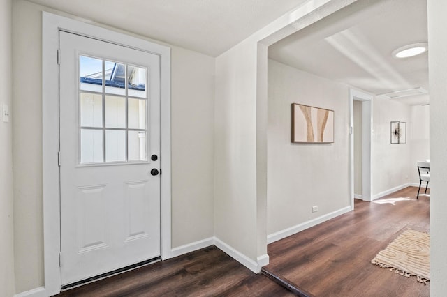 doorway to outside with dark wood-type flooring