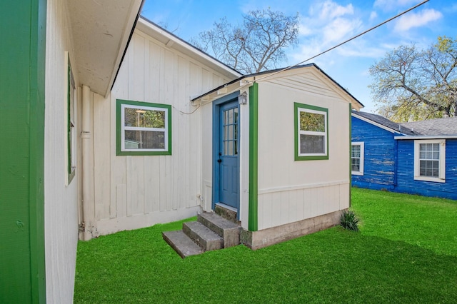 view of outdoor structure with a lawn