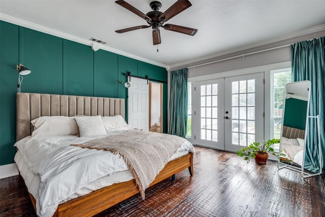 bedroom with french doors, access to exterior, crown molding, dark hardwood / wood-style floors, and a barn door