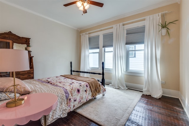 bedroom with dark hardwood / wood-style flooring, ornamental molding, and ceiling fan