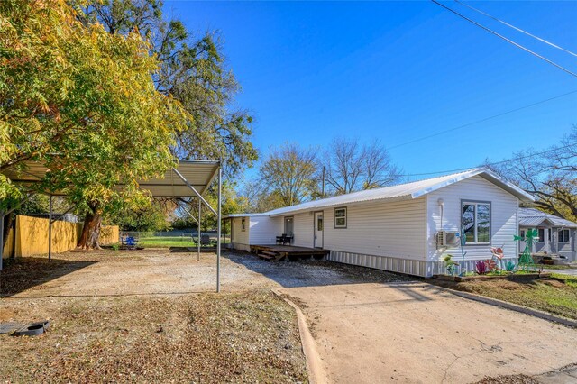 view of front of home featuring a carport